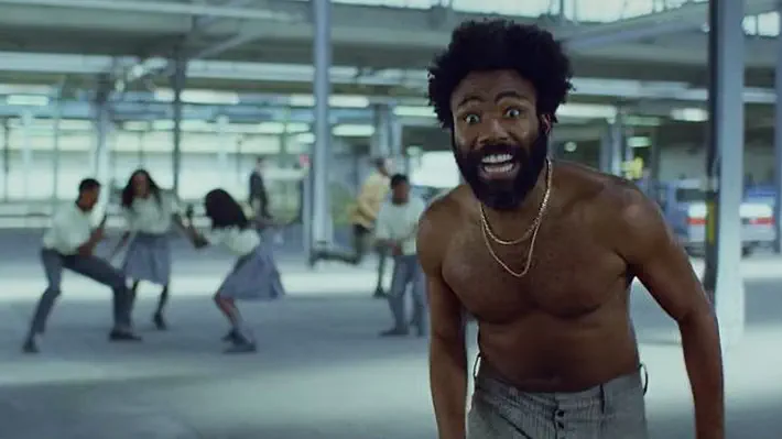 The rapper, AKA Donald Glover, has released a cryptic new video that amassed 10m views in 24 hours and has been hailed as a work of genius. But what does it mean?